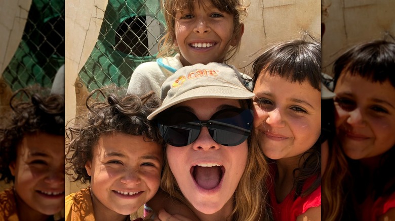 Annie Murphy with children at a refugee camp