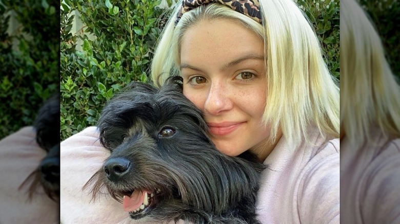 Ariel Winter hugging her dog