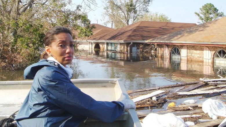 Arthel Neville standing by flooded homes