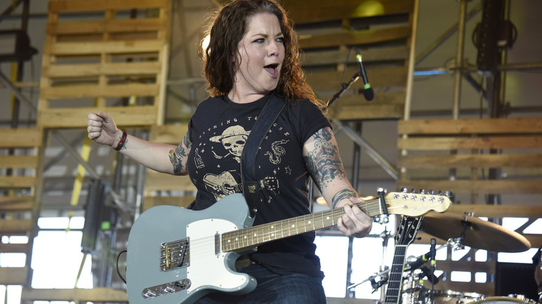 Ashley McBryde playing the guitar