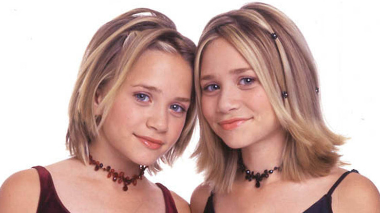 Mary-Kate and Ashley Olsen smiling