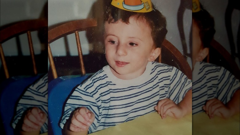 Atticus Shaffer as a child celebrating a birthday