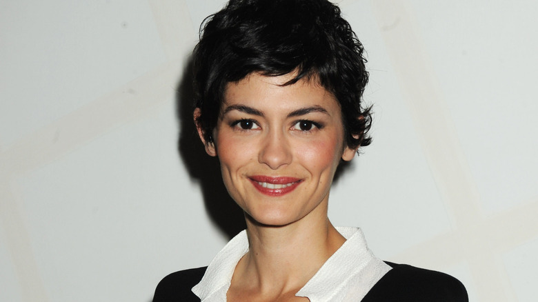 Audrey Tautou in a collared shirt, smiling