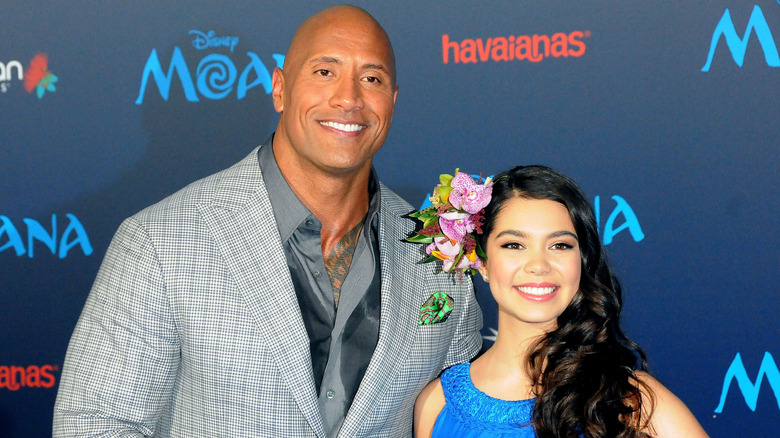 Dwayne Johnson and Auli'i Cravalho smiling