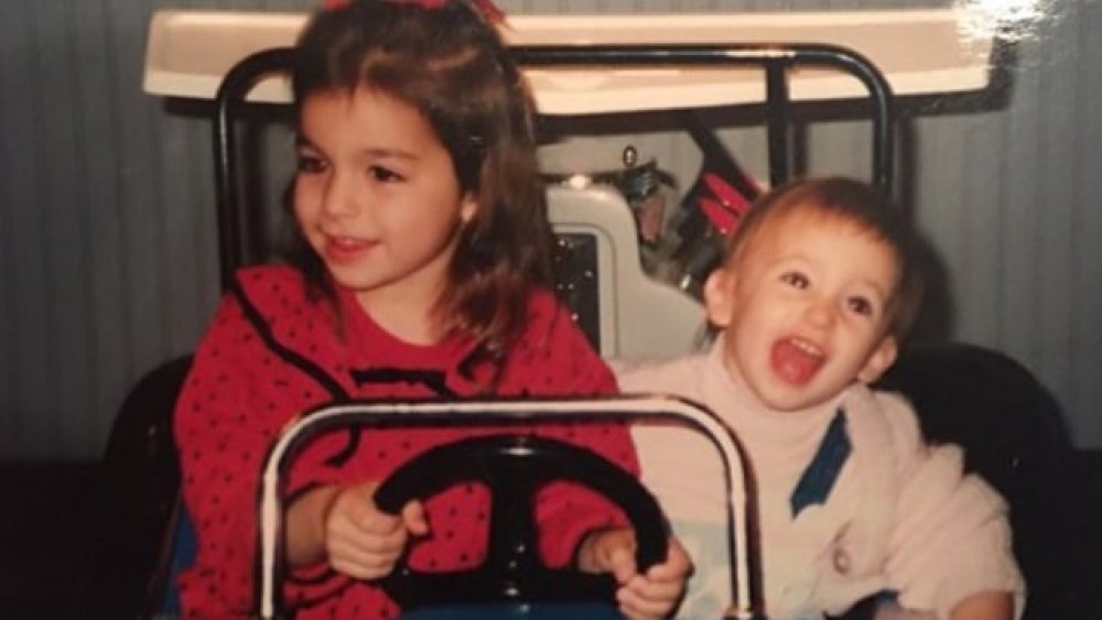 Ashley Iaconetti as a young girl with her sibling