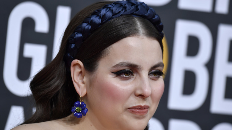 Beanie Feldstein gives small smile