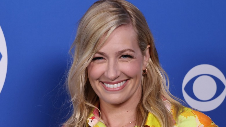 A smiling Beth Behrs