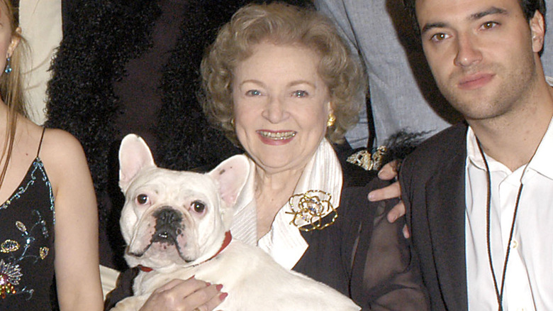 Betty White holding a dog