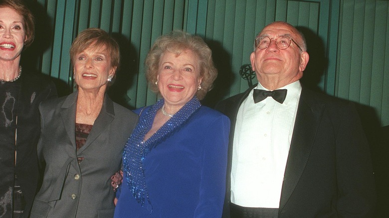 Betty White smiling with colleagues