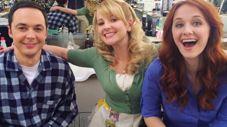 Jim Parsons, Melissa Rauch, and Laura Spencer smiling on the set of "The Big Bang Theory"