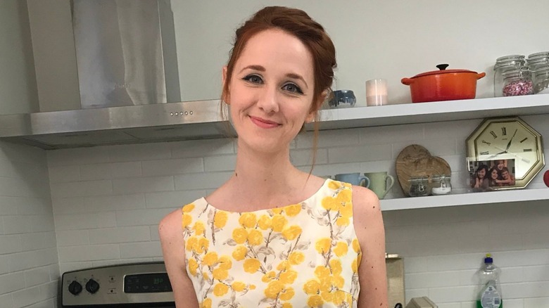 Laura Spencer smiling while standing in a kitchen