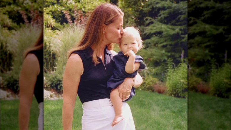 Melinda Gates kisses a baby Phoebe