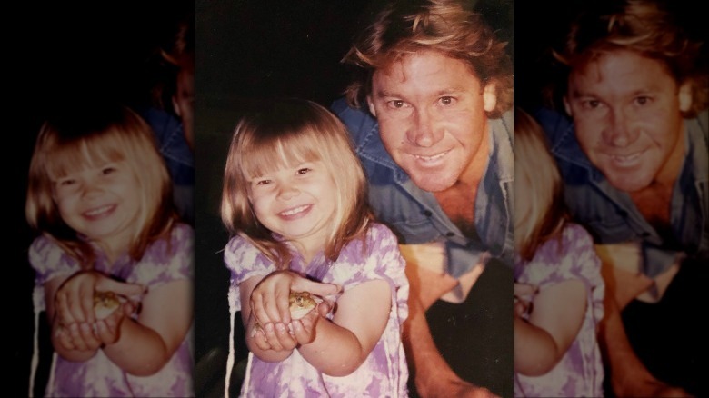 Bindi Irwin with her father and a frog