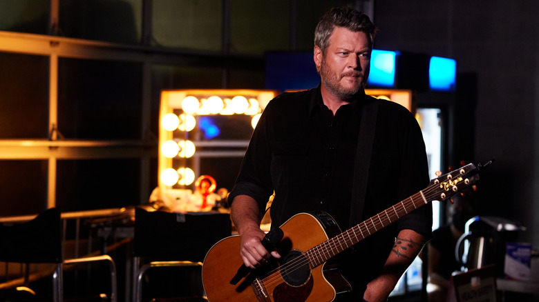 Blake Shelton holding a guitar 