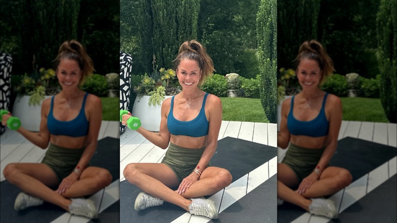 Brooke Burke working out with a dumbell