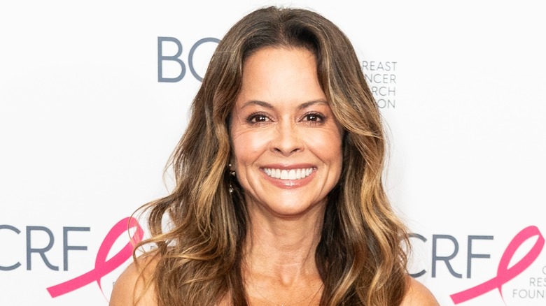 Brooke Burke smiling on red carpet