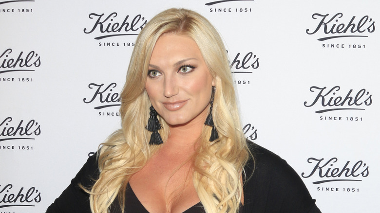 Brooke Hogan posing in a black top