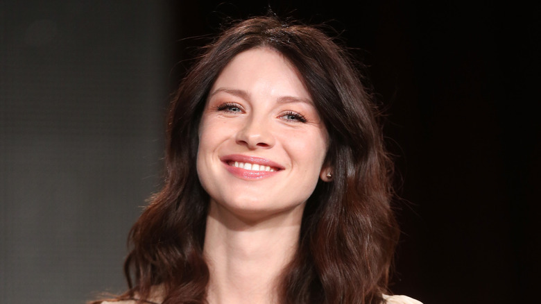 Caitríona Balfe smiling onstage