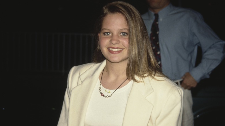 Candace Cameron Bure in a white suit