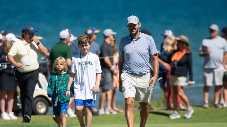 Rivers, Hawkins, and Tony Romo walking