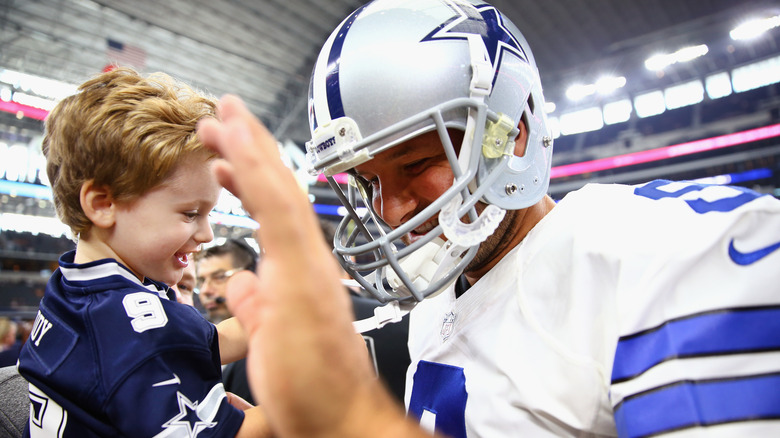 Hawkins Romo and Tony Romo smiling