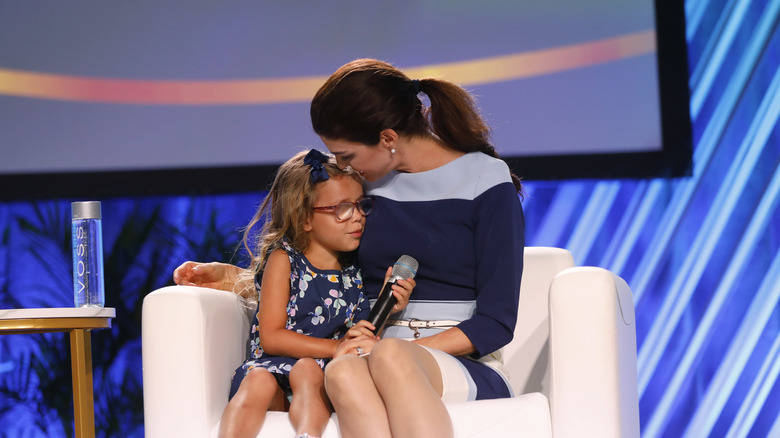 Casey DeSantis sitting with daughter Madison