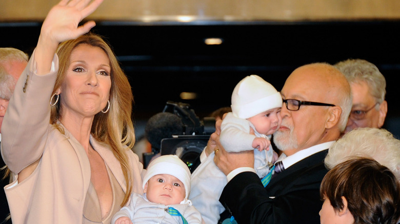 Celine Dion waving with her babies 