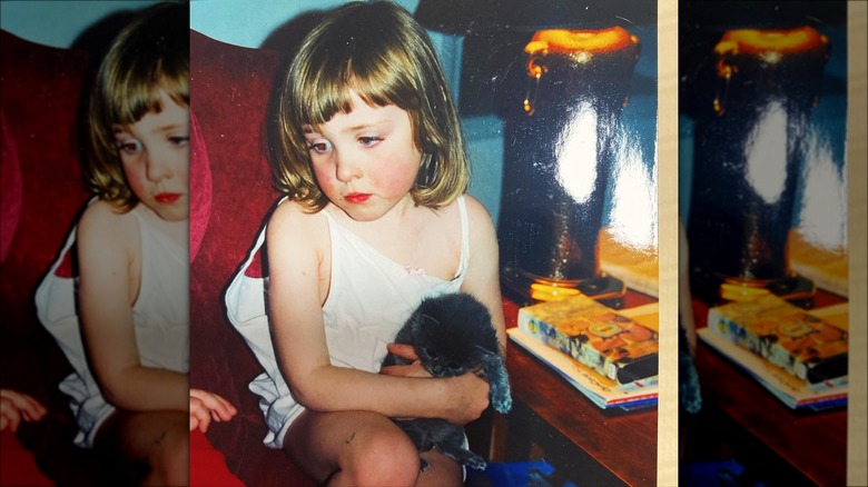 Young Chappell Roan holding cat