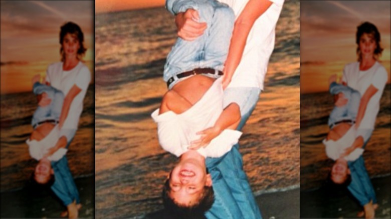 Young Chase Stokes hanging upside down