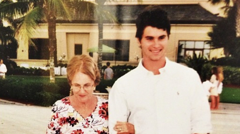 Chase Stokes smiling with grandmother