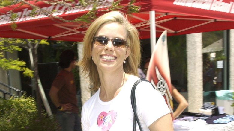 Cheryl Hines smiling in sunglasses