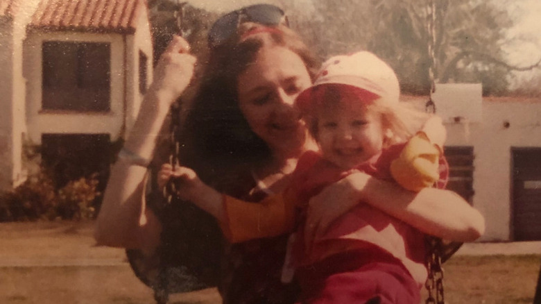 Young Christina Aguilera, mom on swings