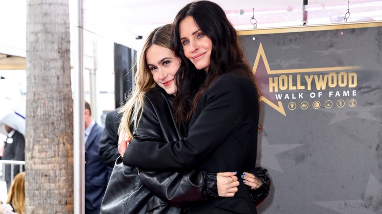 Coco Arquette hugging Courteney Cox 