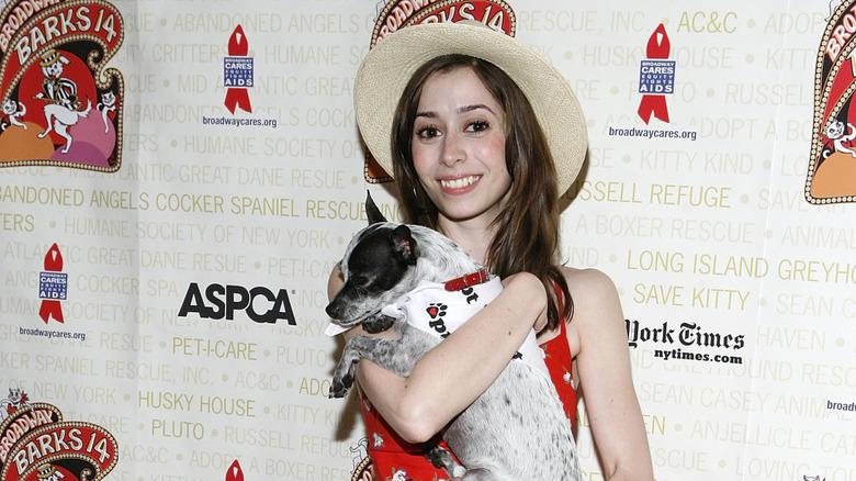 Cristin Milioti holding a dog at Broadway Barks benefit for the ASPCA