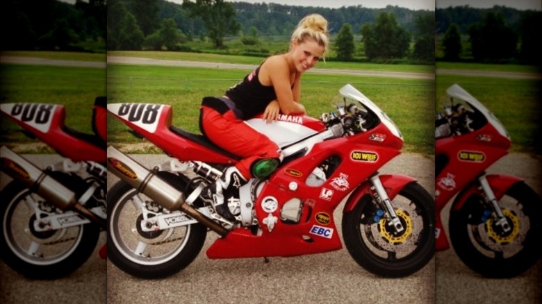 Cristy Lee sitting on a motorcycle