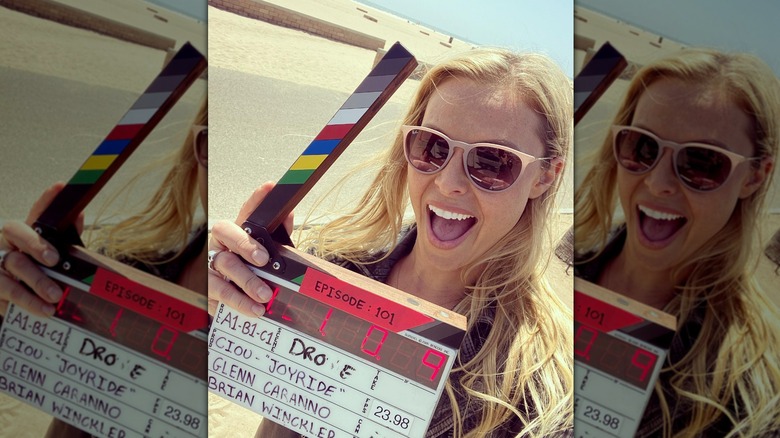 Cristy Lee holding clapperboard