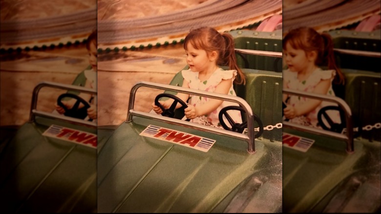 Cristy Lee as a child in toy car