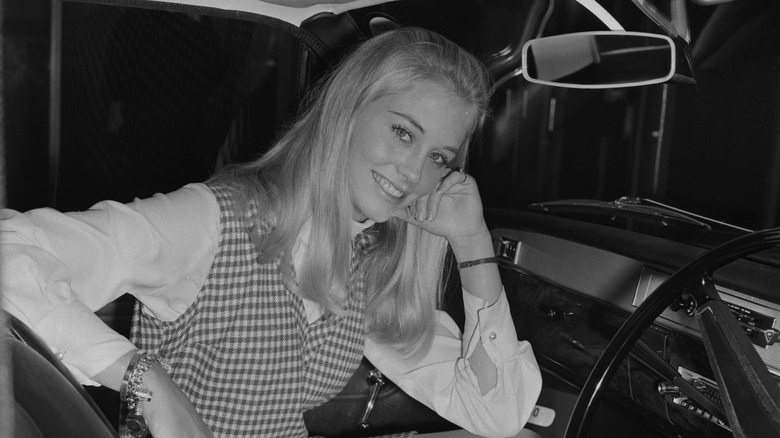 Cybill Shepherd posing in a car in 1968