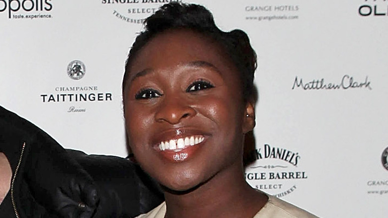 Cynthia Erivo as a younger woman smiling