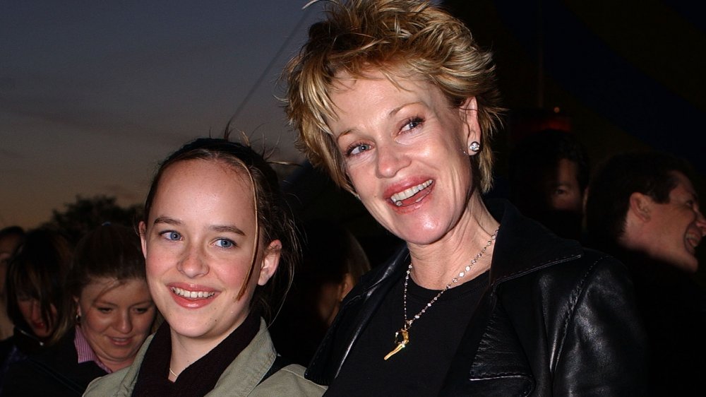 Teen Dakota Johnson and mom Melanie Griffith smiling