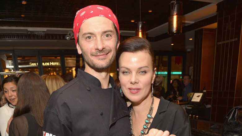 Gabriele Corcos and Debi Mazar in the kitchen at Extra Virgin