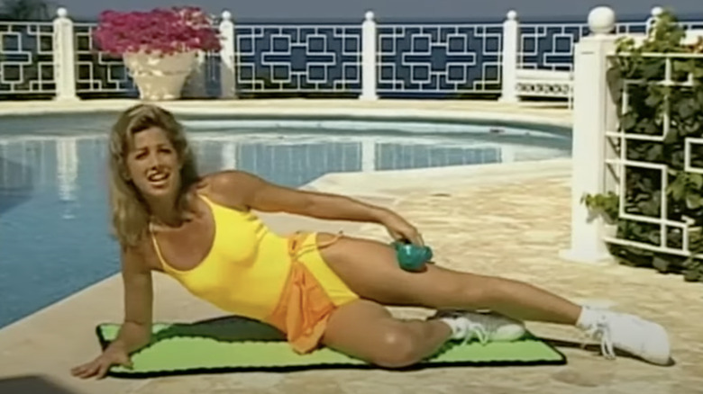 Denise Austin working out by pool