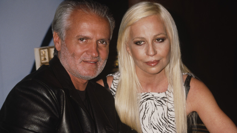 Gianni Versace and Donatella Versace posing