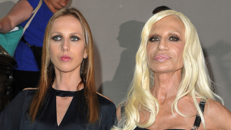 Allegra Versace and Donatella Versace posing together