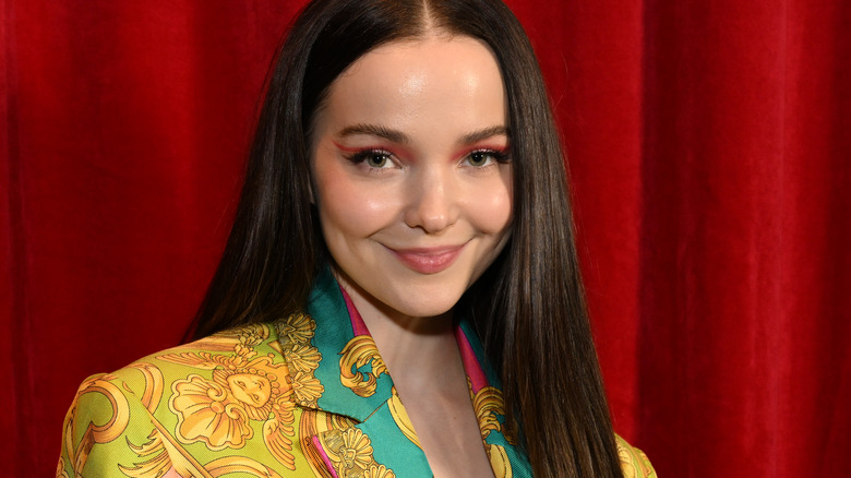 Dove Cameron with red background