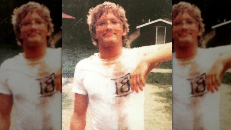 Drew Carey early 20s messy hair glasses