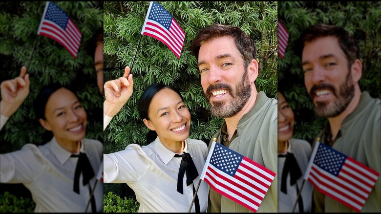 Linda Phan and Drew Scott holding American flags while celebrating Phan's US citizenship