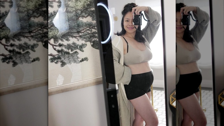 Linda Phan taking a mirror selfie after the birth of her son