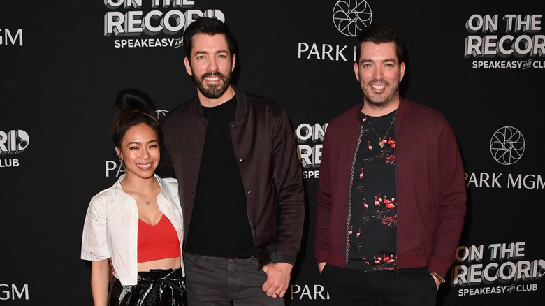 Linda Phan, Drew Scott, and Jonathan Scott posing together