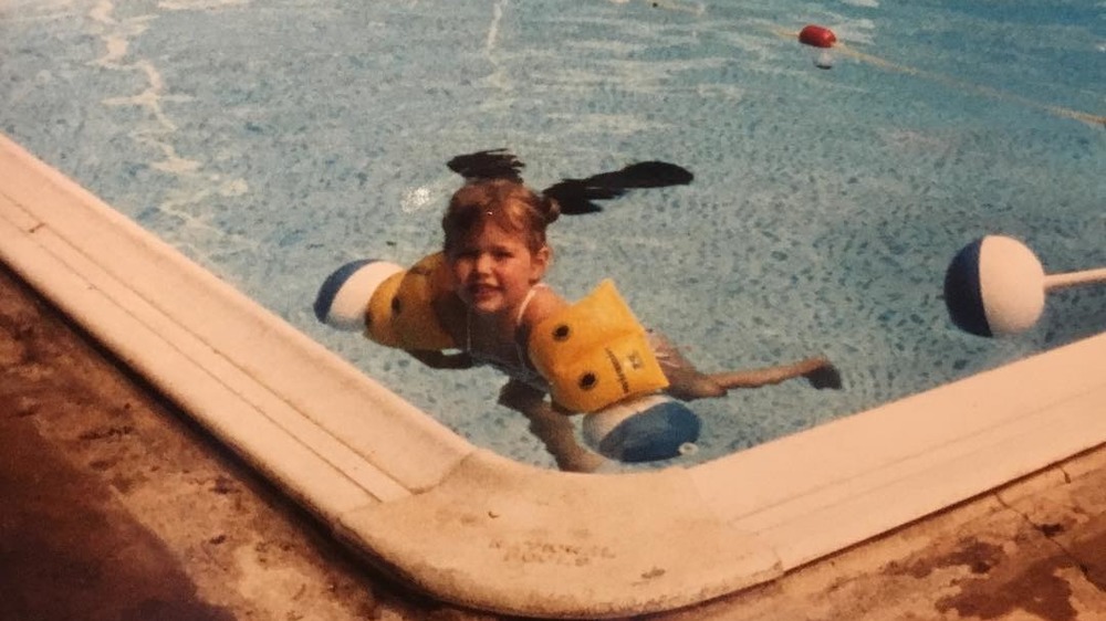 young Dylan Dreyer swimming